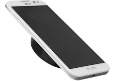 Encima del LG WCP-300 se coloca un celular compatible (Nexus 4, por ejemplo) para cargarlo.